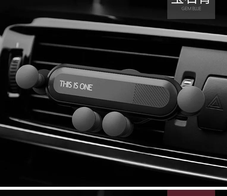Universal black plastic car phone holder clipped onto a vehicle air vent