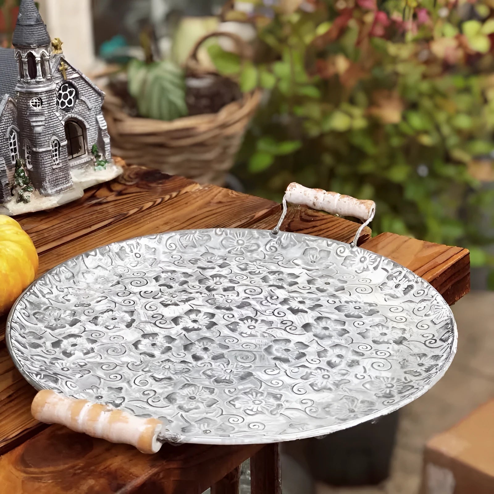 Round wrought iron storage tray in two sizes for organising jewellery or food on a countertop.