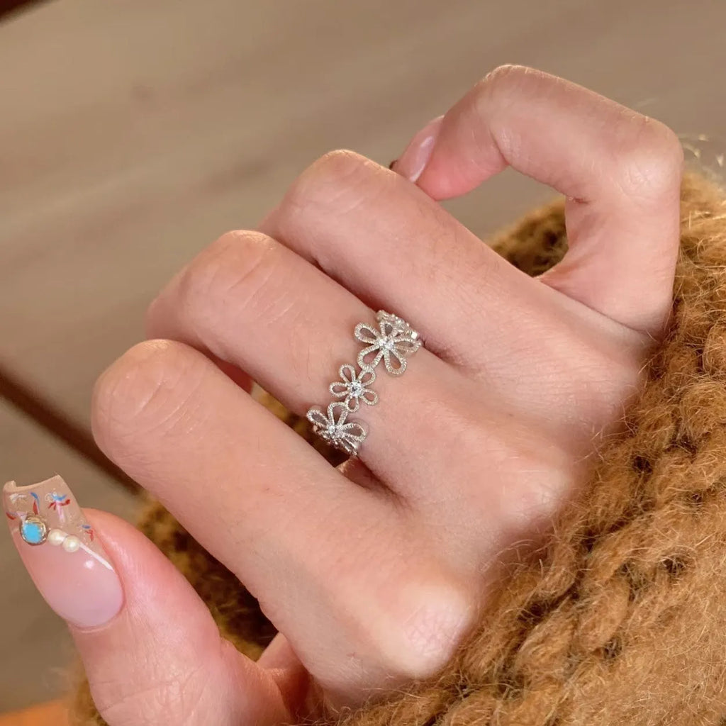 Lace hollow five petal flower ring made of copper with electroplated finish for women.