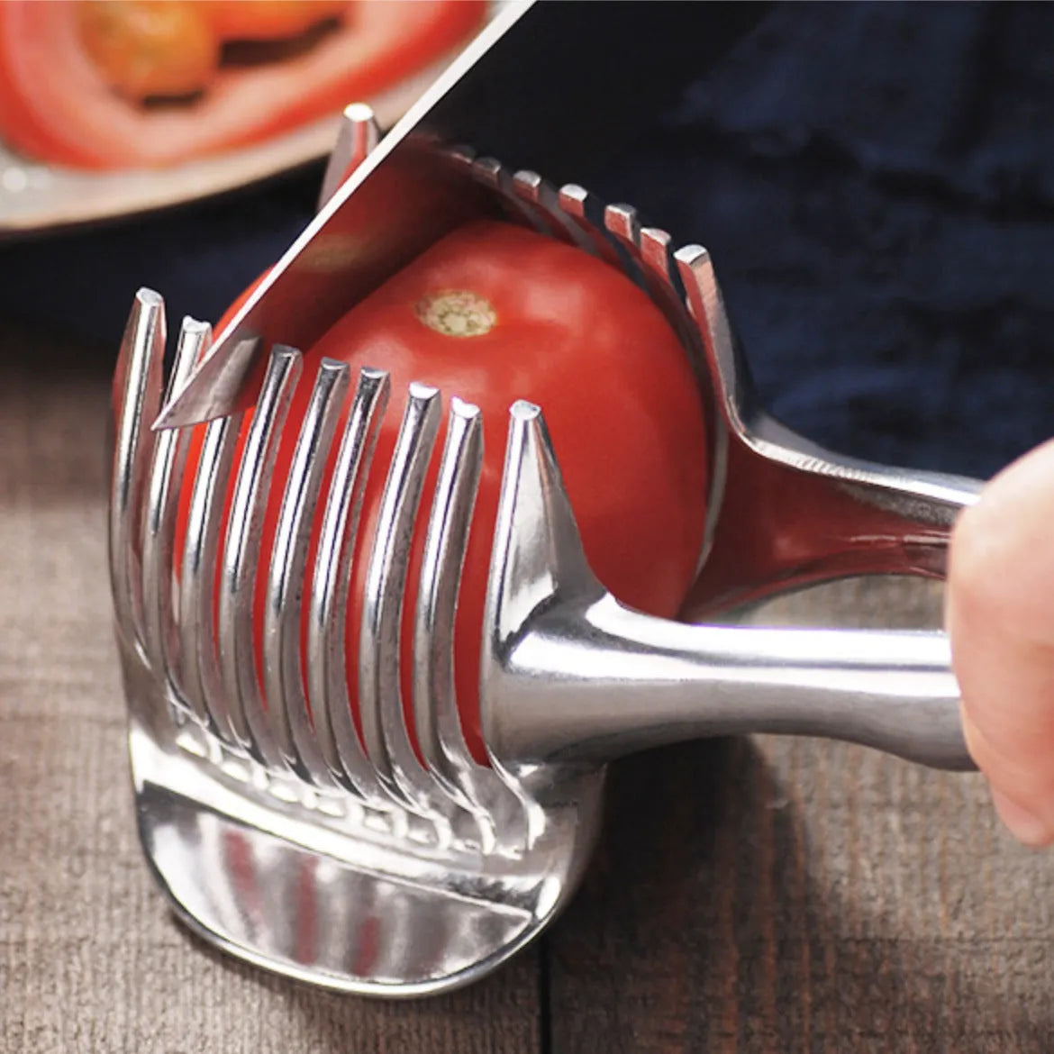 Silver plastic foldable lemon and fruit slicer kitchen gadget shown open for use