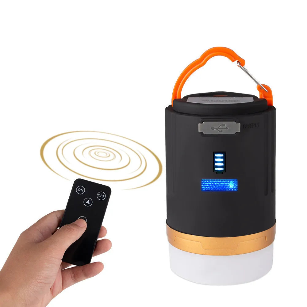 Black rechargeable IPX6 LED camping light with remote control, hanging hook and top magnet on white background
