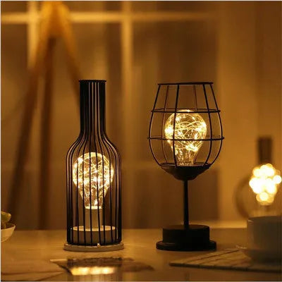 Minimalist hollow wrought iron table lamp with warm white LED light in decorative bottle style