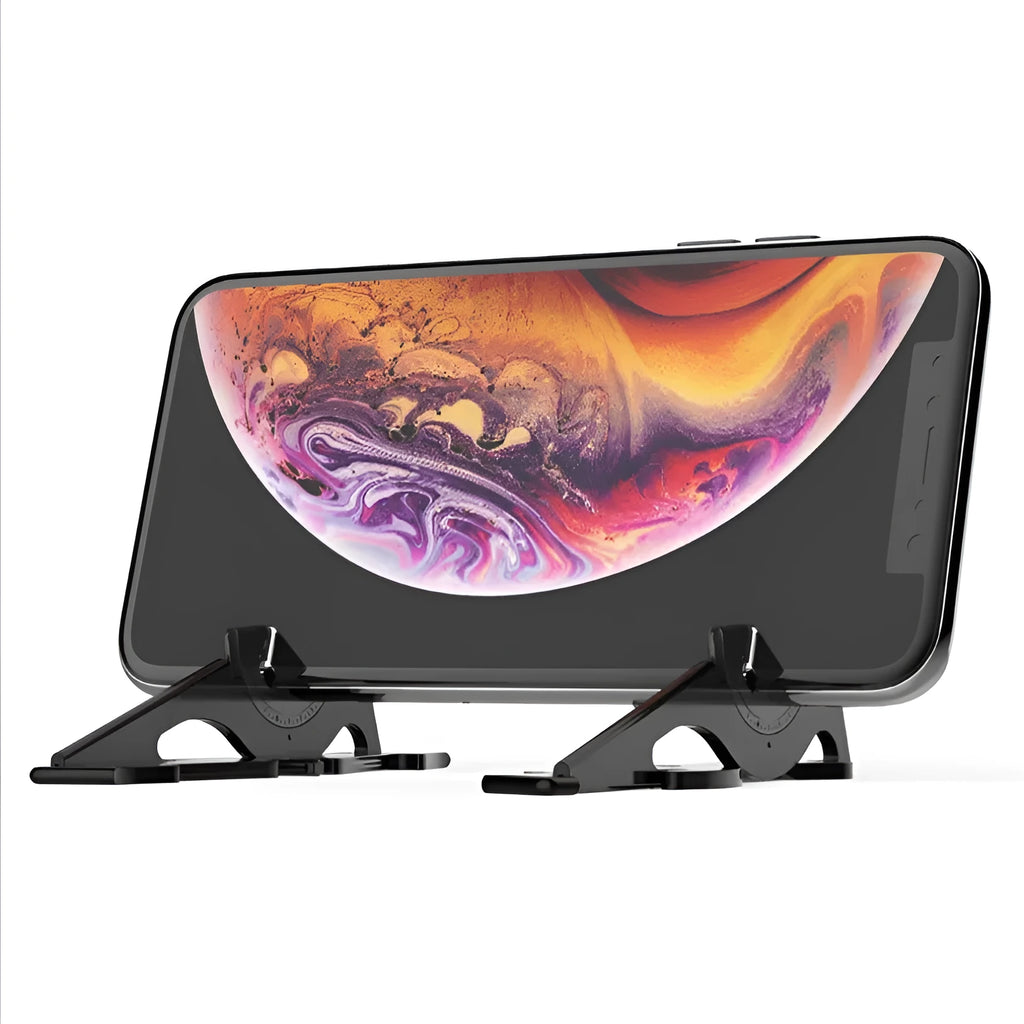 A black plastic card-type mobile phone stand on a desk.