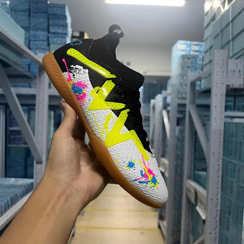 Low-top football boots with replaceable rubber studs on a non-slip sole, in Black and Yellow colourway.