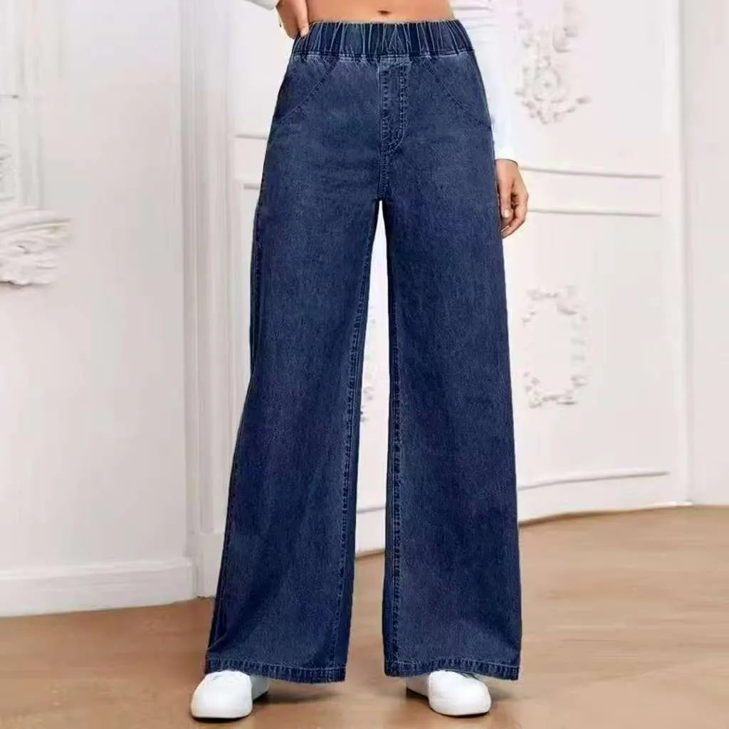 Light blue washed wide-leg denim jeans with straight-leg cut and mid-waist design