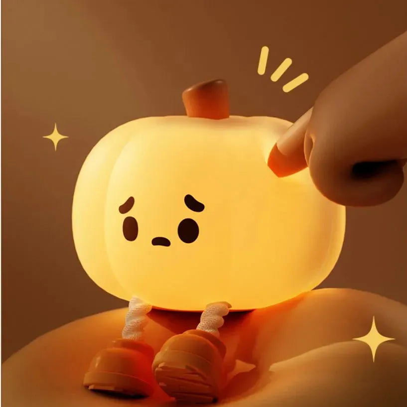 Orange pumpkin silicone night light with soft glowing illumination and touch controls