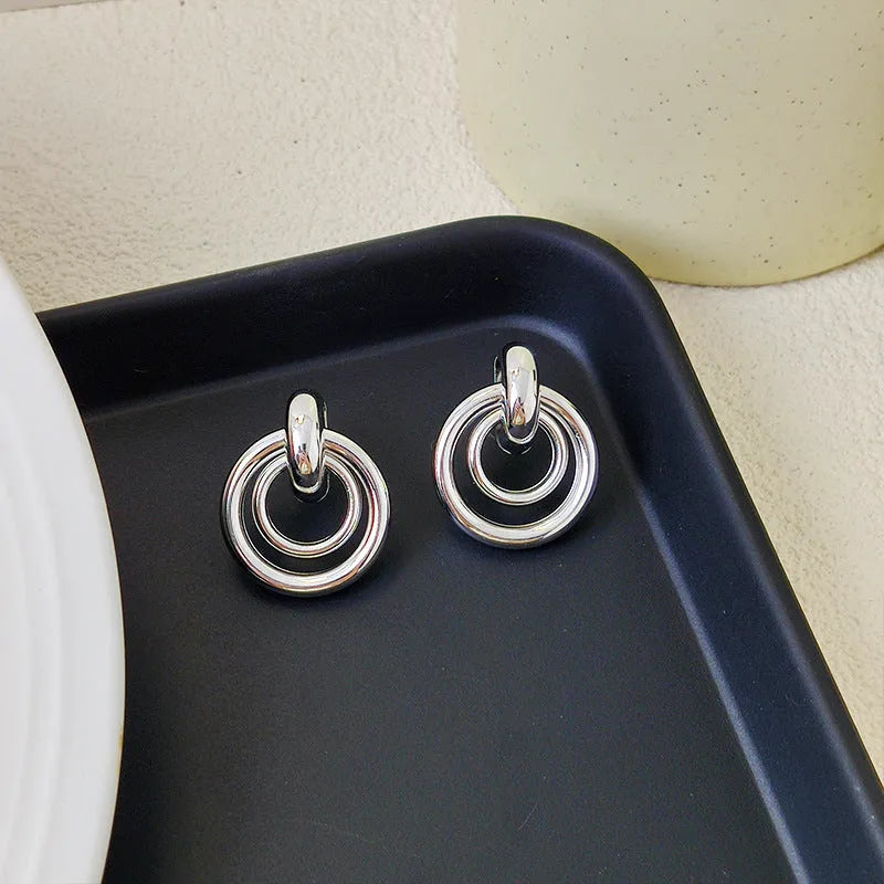 Geometric round ring earrings with irregular design in gold electroplated finish