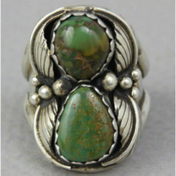 Women's silver-toned geometric alloy ring with a square turquoise blue inlaid centre on a white background.