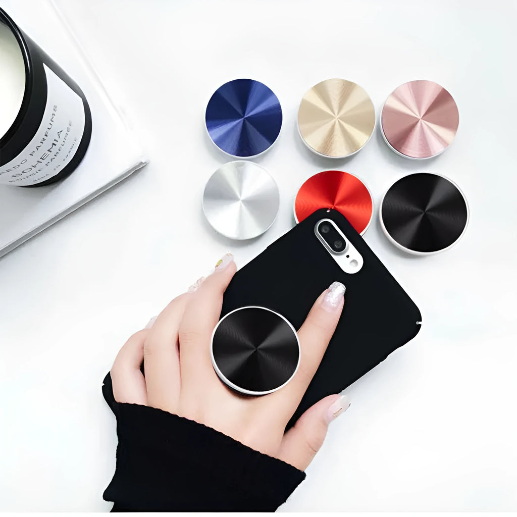 Ring phone stand in silicone and metal acting as a grip and stand for a mobile phone