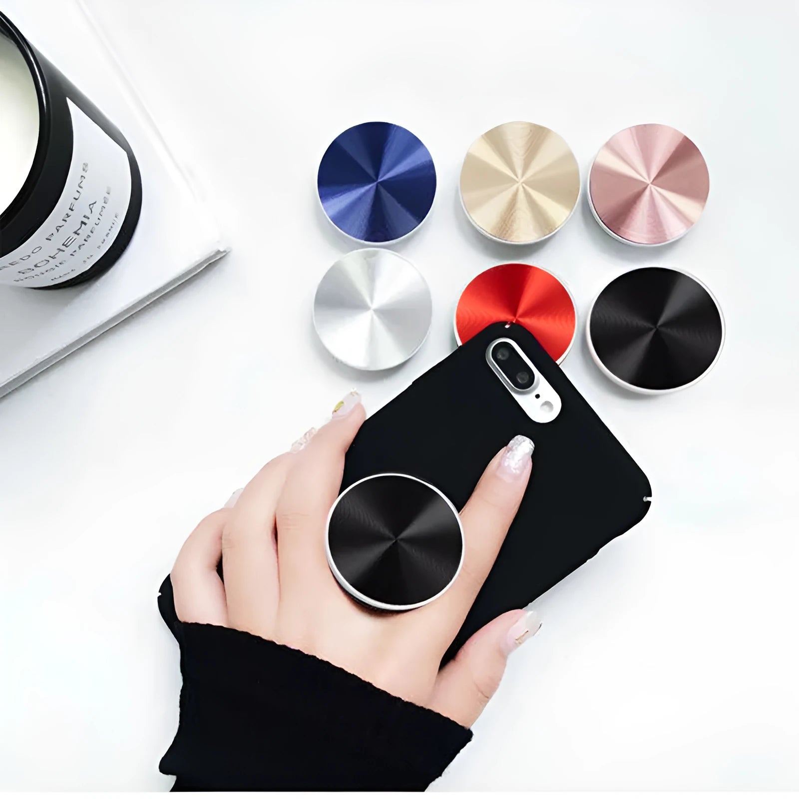 Ring phone stand in silicone and metal acting as a grip and stand for a mobile phone