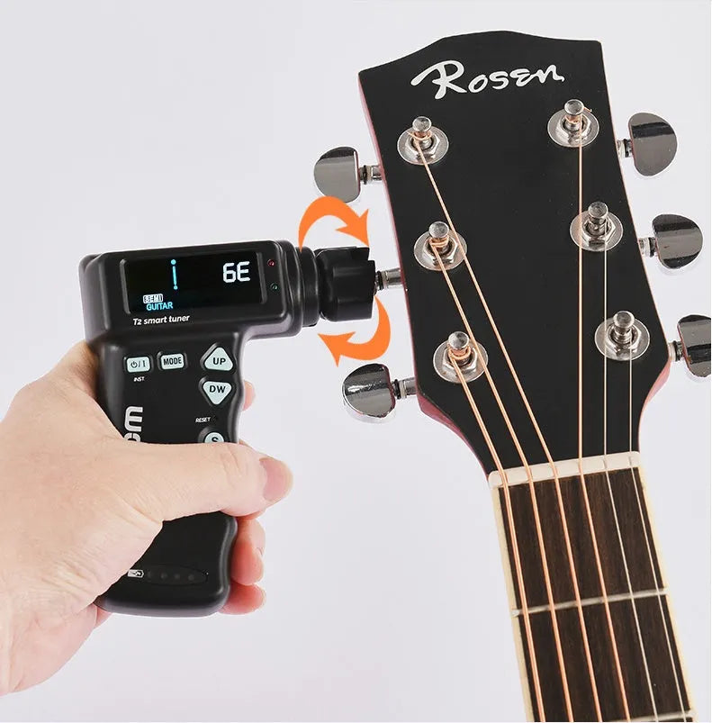 Black and white smart guitar tuner and string winder with colourful LCD display