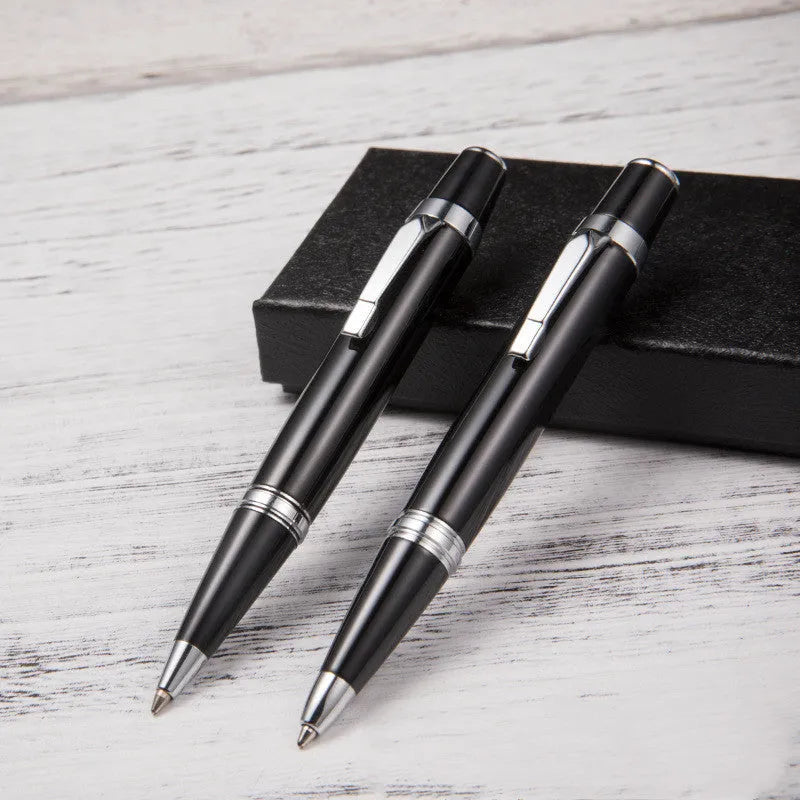 Short black metal ballpoint pen with rotating mechanism shown retracted and extended.