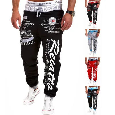 Drawstring loose track pants in black and white with elasticated waistband and adjustable drawstring, available in multiple sizes.