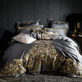 Four-piece cotton embroidery bed set in grey, comprising duvet cover, fitted sheet, and two pillowcases, satin weave finish