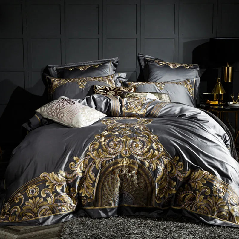 Four-piece cotton embroidery bed set in grey, comprising duvet cover, fitted sheet, and two pillowcases, satin weave finish