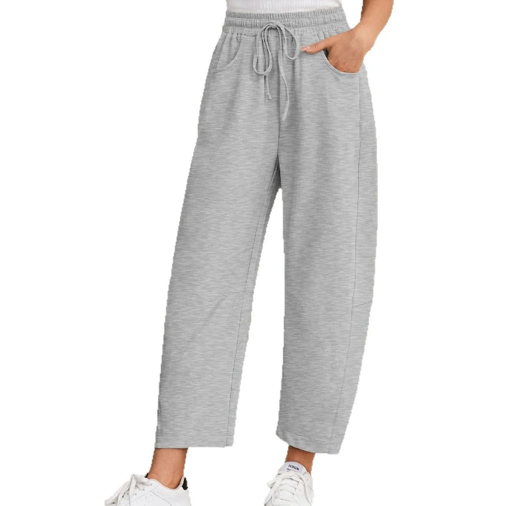 Women's loose cropped sweatpants in cotton fabric with elastic drawstring waistband in street fashion styling