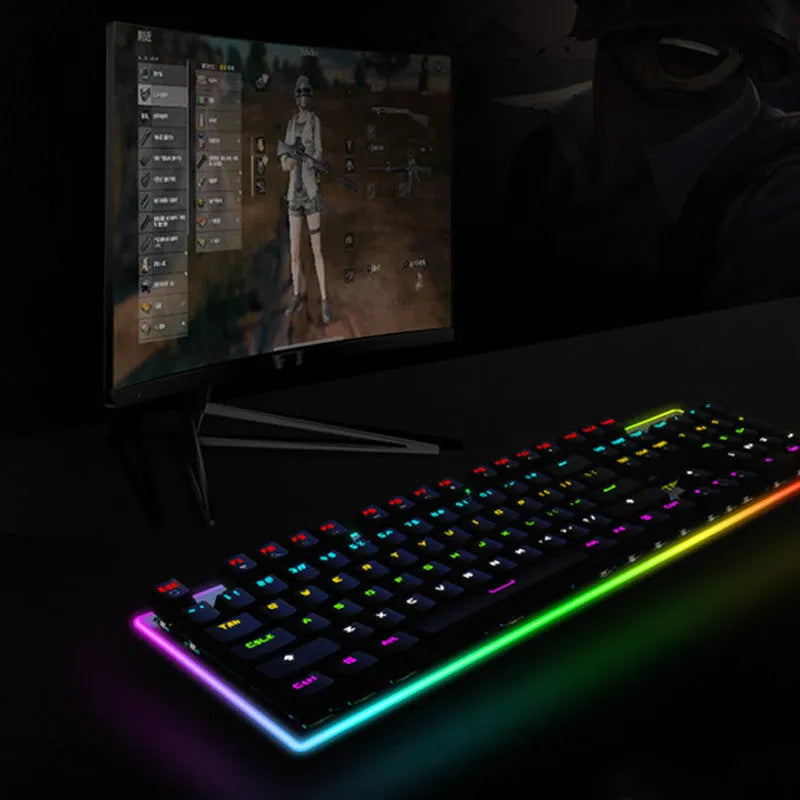 Real mechanical keyboard with RGB backlight, metal frame, 104 keys, and USB cable on a desk