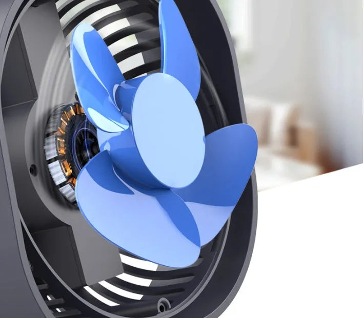A small, modern USB desk fan in blue with a rotating head on a white desk.