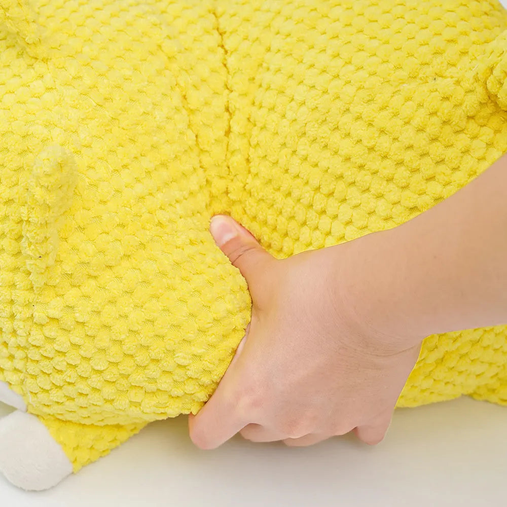 Plush calming dog toy with pillow shape, textured surface, and squeakers inside