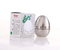 Stainless steel egg-shaped mechanical kitchen timer on a kitchen worktop.