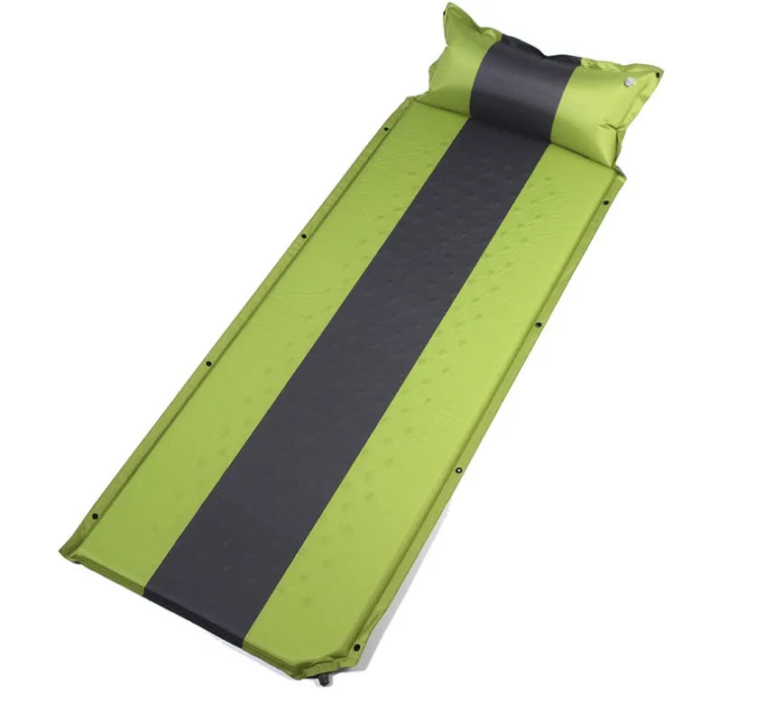 Outdoor automatic inflatable camping mat for one person with memory foam filling, blue and grey colour, shown on grass