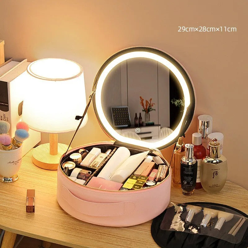 Round pink PU leather makeup bag with built-in LED illuminated mirror and internal cosmetic partitions open.