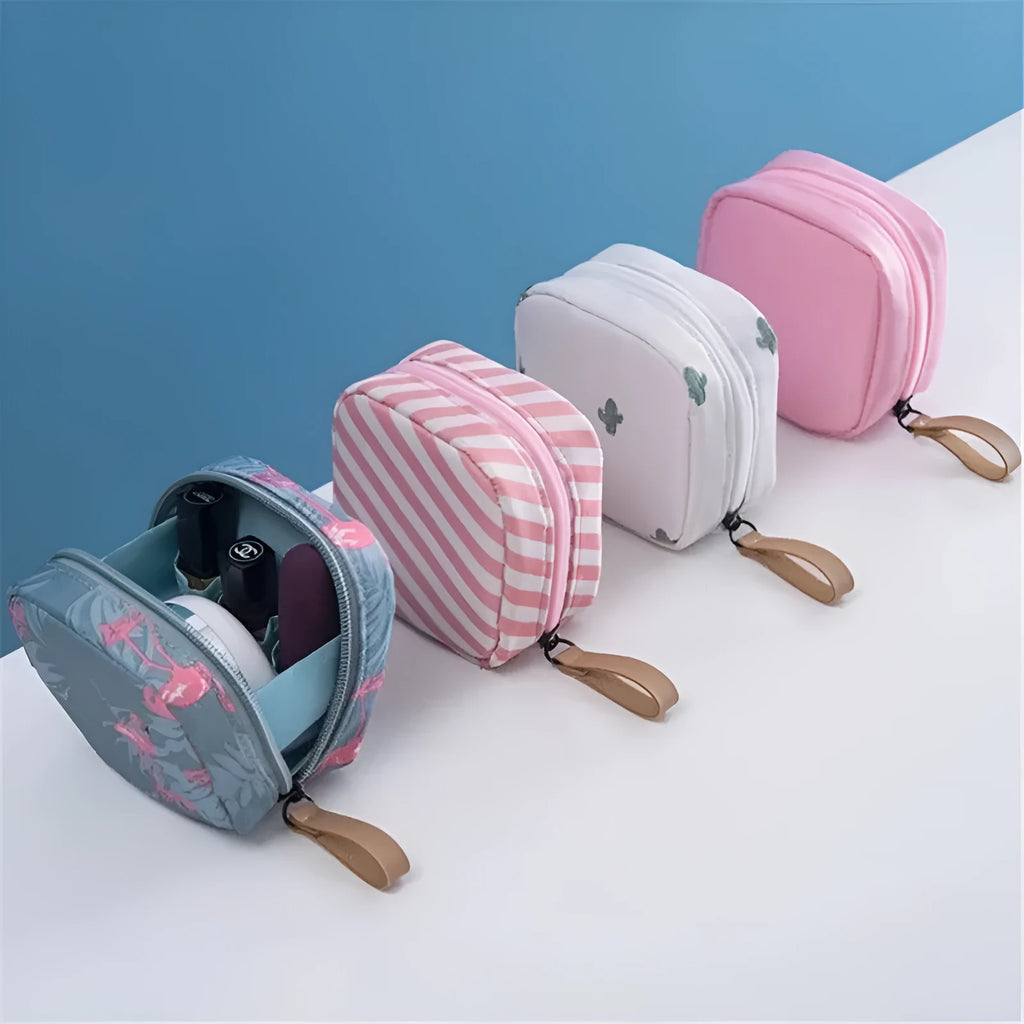 Blue cloth cube-shaped makeup storage bag on a table.
