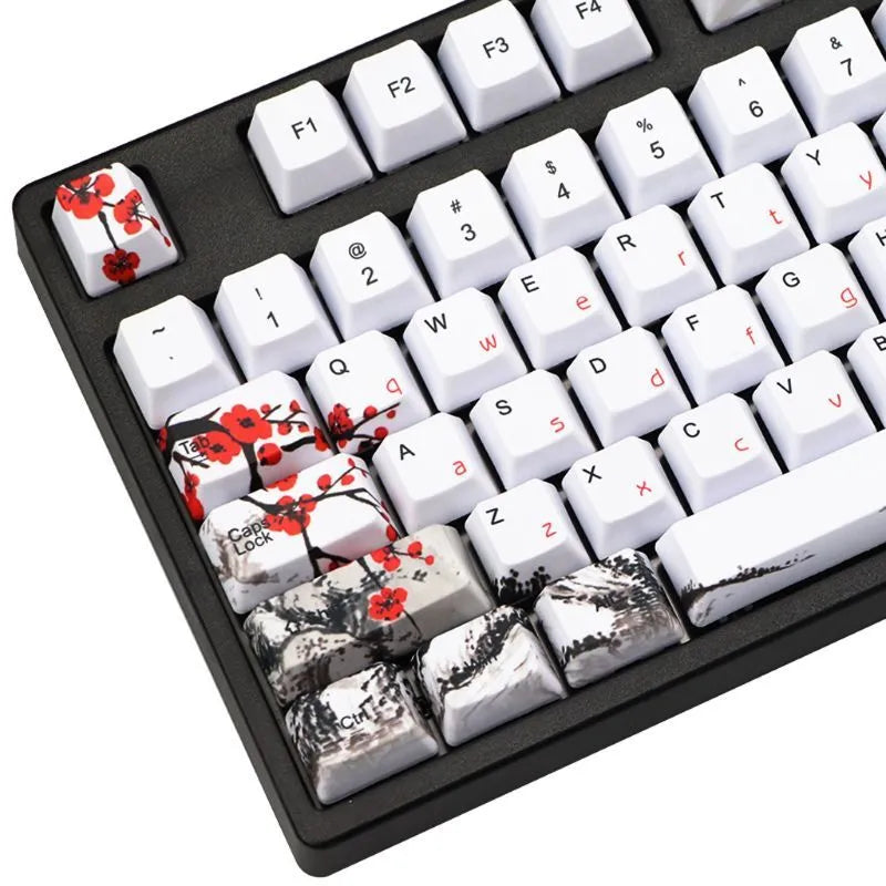 Set of 109 PBT keycaps with plum blossom design on a black background, showing Japanese legend style.