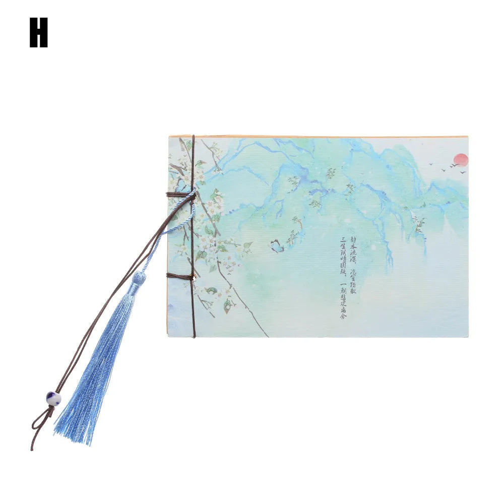 A5 kraft paper notebook with a hand-stitched binding and a hanging tassel bookmark in a natural design.