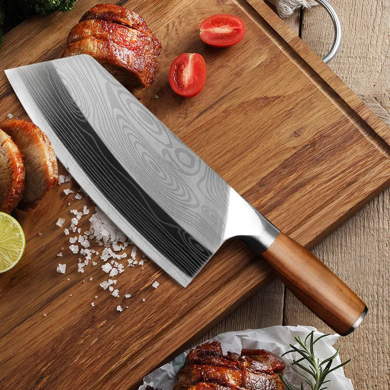 Stainless steel kitchen knife with a 320mm blade on a kitchen counter.
