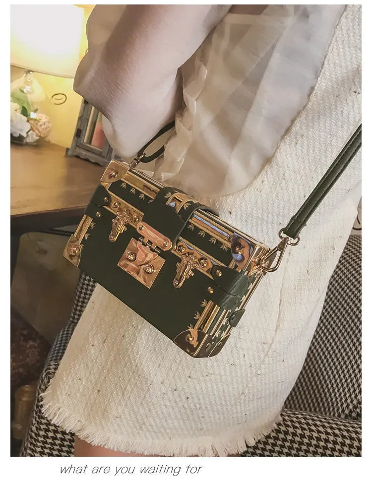 Hard black PU women's shoulder handbag with flap, hasp closure, and decorative rivets.