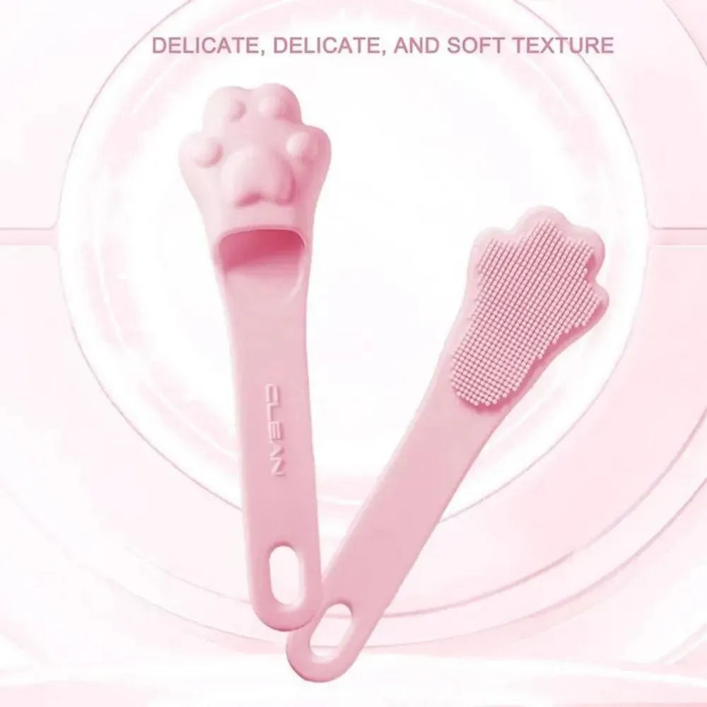 Silicone finger toothbrush for pets in pink, purple and yellow colours