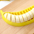 Yellow banana slicer made from food-grade PP plastic on a light background