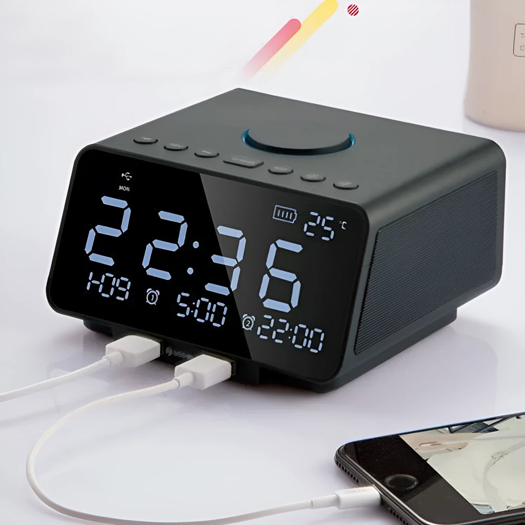Black and white wireless alarm clock Bluetooth speaker with control buttons on top.