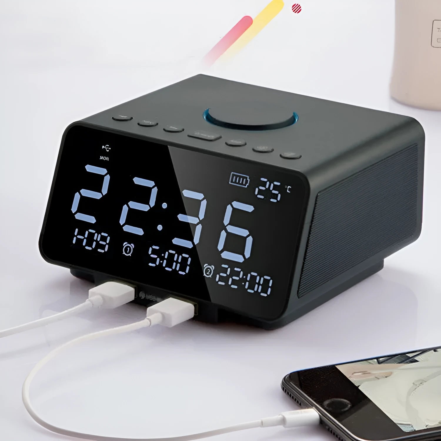 Black and white wireless alarm clock Bluetooth speaker with control buttons on top.