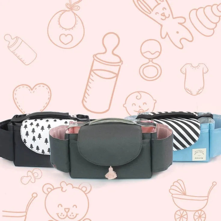 Pink tassel multifunction baby stroller bag organizer attached to stroller handles