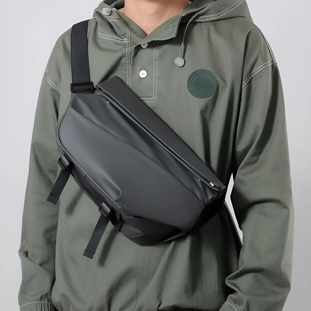 Grey men's medium square crossbody bag made of PU with a single shoulder strap and soft handle.