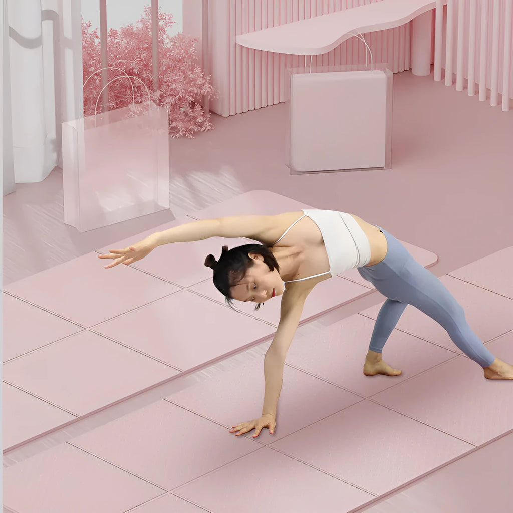 A folded and unfolded purple TPE yoga mat on a wooden floor, showing its size and folding design.