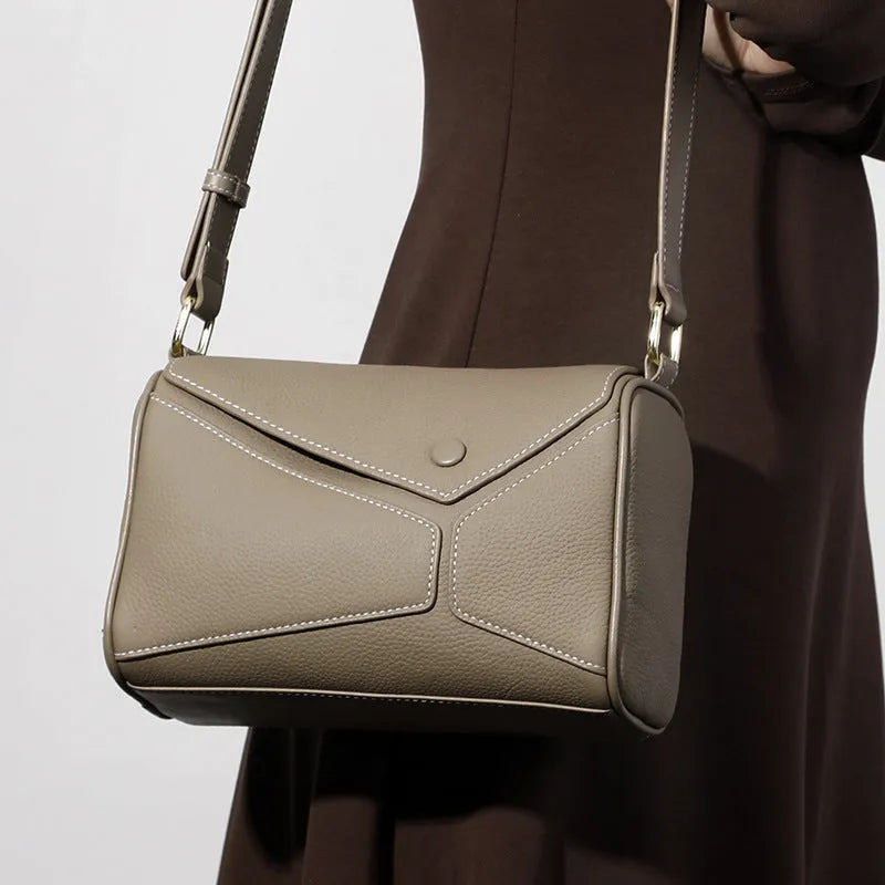 Women's genuine leather crossbody bag in soft first layer cowhide, square shape, 22x11x15cm, black colour option on a plain background