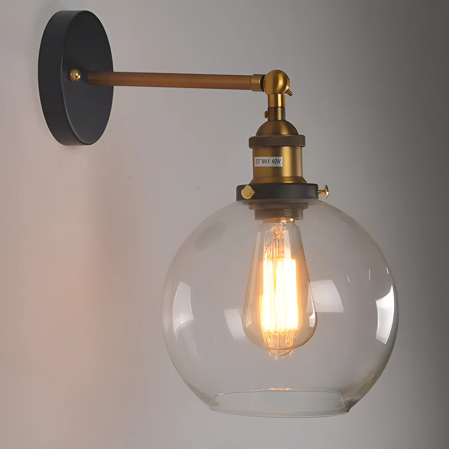 Round retro glass ball wall lamp in amber colour, 20cm diameter, with aluminium holder.