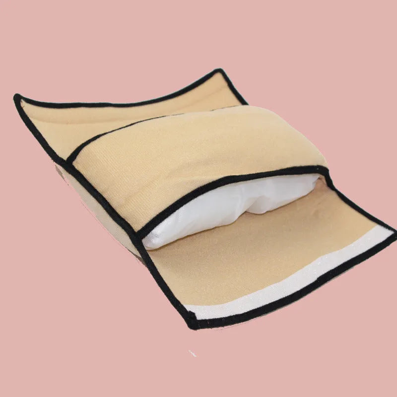 Children car pillow in grey micro-suede fabric attached to a car seat belt shoulder strap