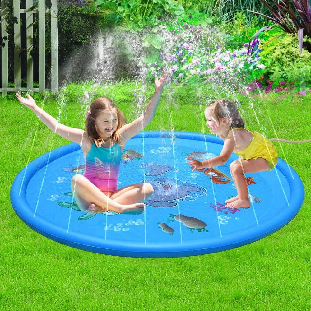 Blue PVC children's water spray play mat with marine animal designs laid flat on grass.