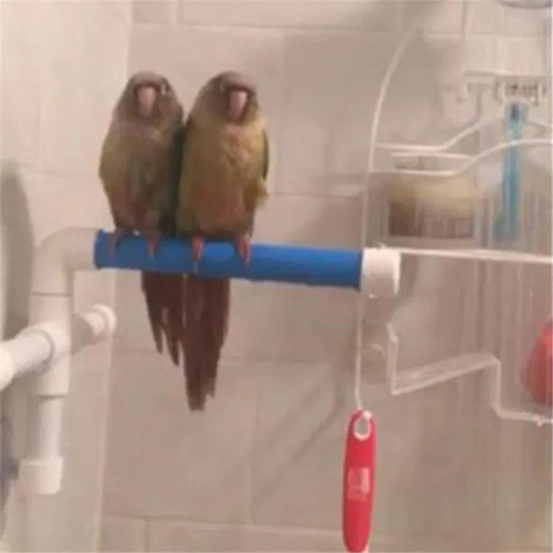 White foldable plastic parrot bath shower stand with three suction cups on a shower wall