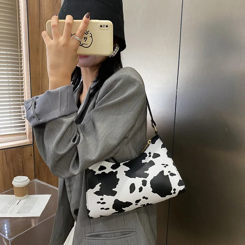 Women's small square leopard print underarm bag in soft PU with zip closure and single strap