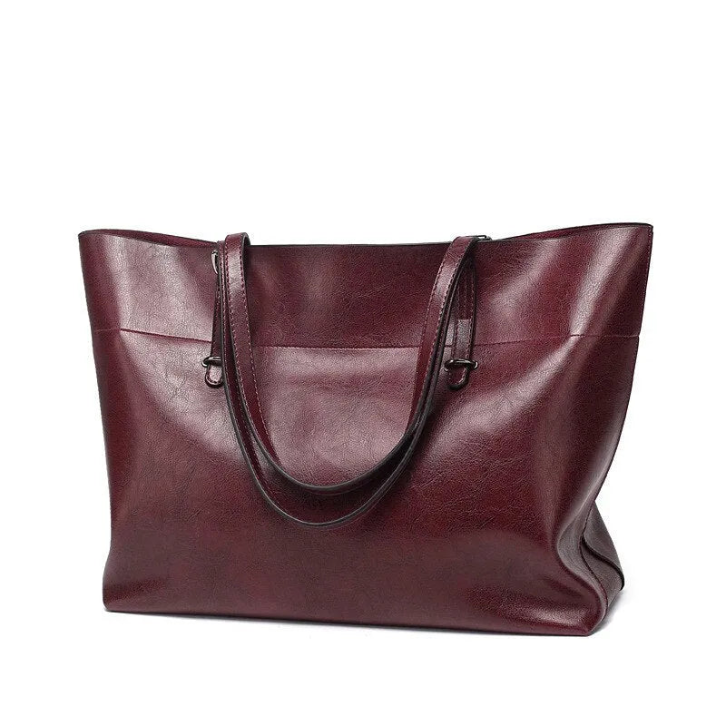 Horizontal waxed cowhide leather women's crossbody handbag showing internal phone pocket and two compartments.