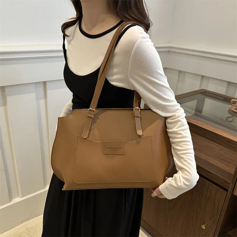 Women's structured PU tote bag in neutral colour with phone pocket and double shoulder straps.