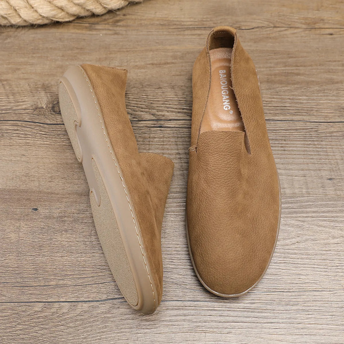 Handmade low top men's shoes in khaki or grey with a flat wedge heel and rubber sole.