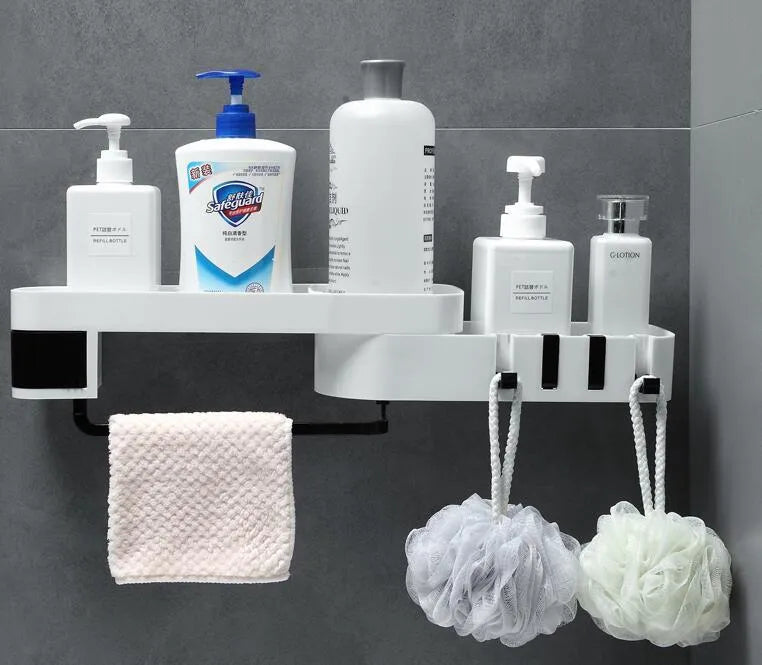 White and black retro European style corner shelf with suction mount on a bathroom wall.