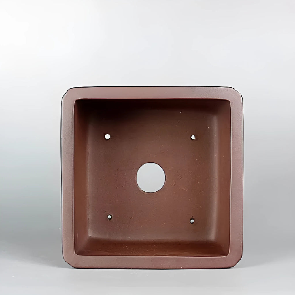 Brown handmade purple clay flower pot with antique finish.