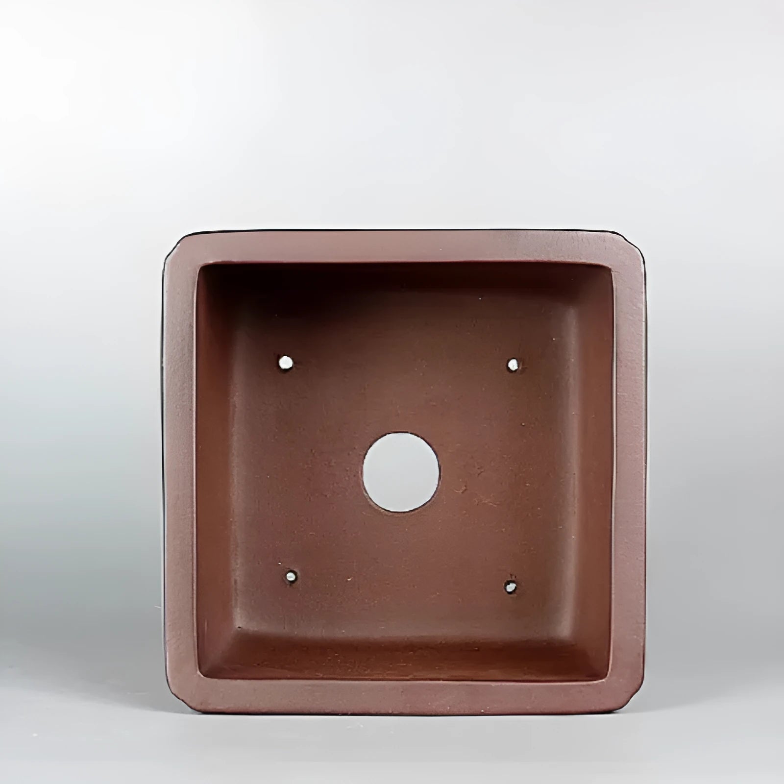 Brown handmade purple clay flower pot with antique finish.